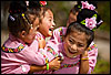 Four of a Kind Photo: Ethnic Miao girls yuk it up before their traditional dance practice. 