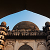 Golgumbaz Photo: A mausoleum for a deceased Muslim ruler, Mohammed Adil Shah.  His wives, mistress and other members of his family are also entombed within. The second photo shows the textured floor of the Golgumbaz lighted by one of the few windows in the massive interior of the building.