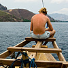 Ghetto Dragon Cruise Photo: A British national, Chris, sits on the bow of our chartered boat.