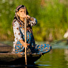 Paddling Pairs Photo: Two boating women approach one another on the back waterways of Dal Lake.