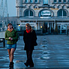 Watering Hole Photo: Two women take an evening stroll on the elevated path connecting Het Steen and a well-housed bistro.