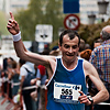 26.2 Photo: A marathon runner gestures as he approaches the finish line near Grote Markt.