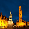 Downtown Dusk Photo: A statue in Grote Markt is backed by the provincial courthouse and belfry.