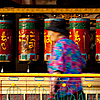 Blurred Buddhists Photo: Tibetan Buddhists spin prayer wheels at a temple (Archived photos on the weekends).