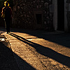 Evening Shadow Photo: Woman and shadow in an ancient alleyway near old town.