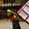Boy Beast of Burden Photo: A young Egyptian boy struggles to pull a dolly full of merchandise in Islamic Cairo.