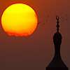 Sunni Sky Skewers Photo: A mosque's minaret in Islamic Cairo at sunset.