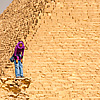 Pyramids People (Panorama Inside) Photo: A young Egyptian girl laughs with a friend near the Pyramid of Khufu (Cheops in Greek).