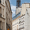 Iconic Iron Photo: The Eiffel Tower sprouts over residential buildings in Paris.