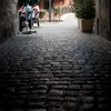 Rocky Road Photo: An ancient tunnel with cobblestone path in the old city in Annecy.