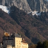 Fairy-Tale Fort Photo: The Chateau Menthon-Saint-Bernard backed by the cliffs and peaks of the French Alps.